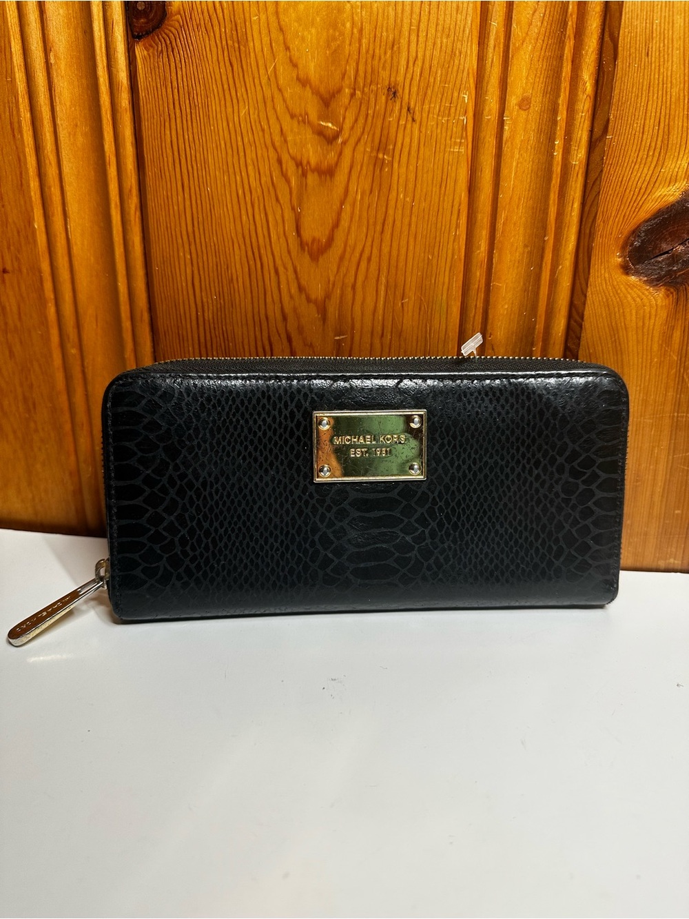 Michael Kors Black Embossed Zip-Around Wallet with Gold Plaque